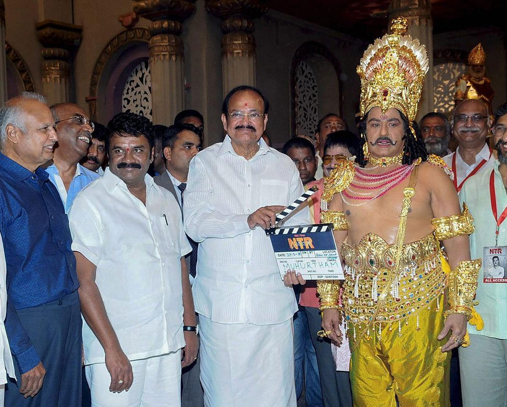 Vice President M Venkaiah Naidu gave the muhurat clap for the biopic on actor-turned-politician N T Rama Rao, which has been titled NTR, here at the Ramakrishna Studios on Thursday. PTI photo