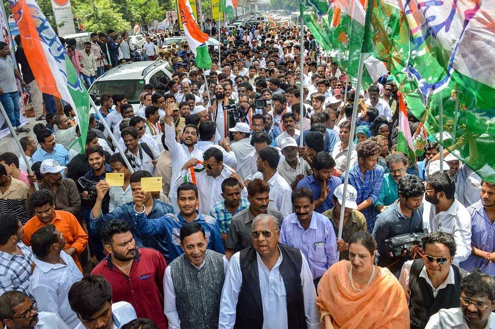  AICC in-charge RC Khuntia and TPCC chief N Uttam Kumar Reddy participate in 'Walk for 12% Muslim Reservation' reportedly promised by TRS Government, in Hyderabad on Monday. PTI Photo