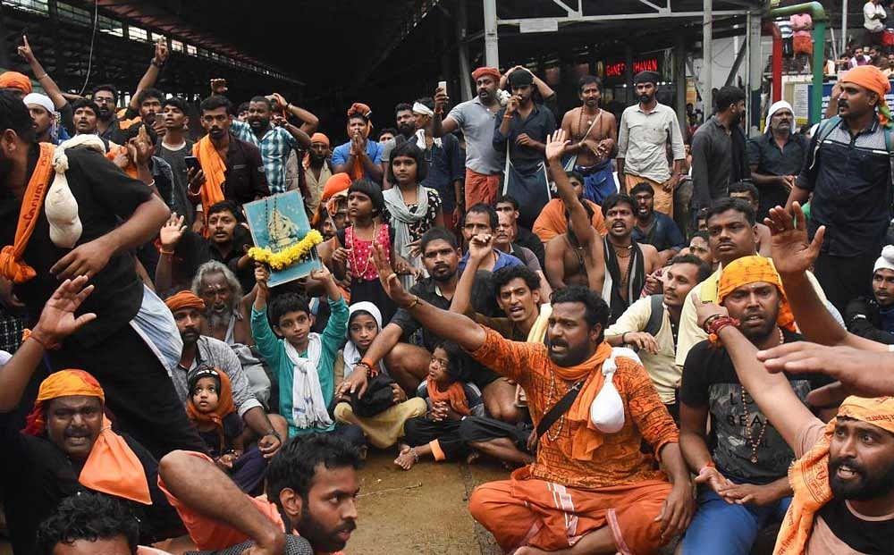 Protesters oppose the entry of women to the Sabarimala Temple. PTI 