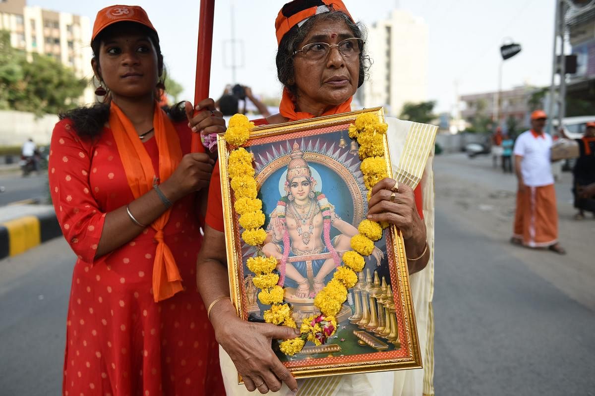 Ayyappa devotees participate in a peaceful protest rally against the Supreme Court decision to allow women of all ages to enter the Sabarimala temple, in Ahmedabad. (AFP File Pic)