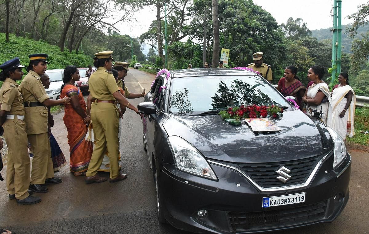 Women protesters check Sabarimala bound vehicles at Nilakkal to ensure that no women in the age group between 10 and 50 are going to Lord Ayyappa temple in dense forests at Sabarimala, on Tuesday, October 16,2018. (PTI Photo)