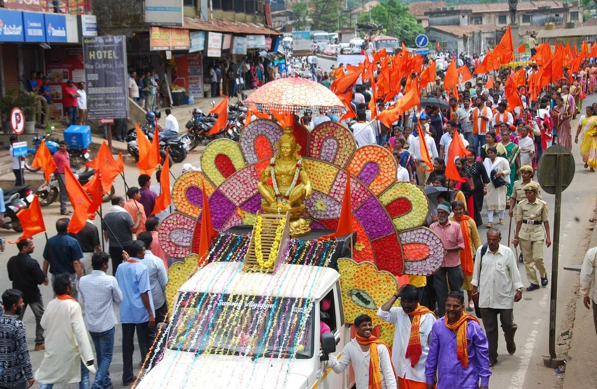 Sabarimale Ayyappaswamy Samrakshana Samithi and Muthappa Temple Samithi members take out a procession in Madikeri on Friday.
