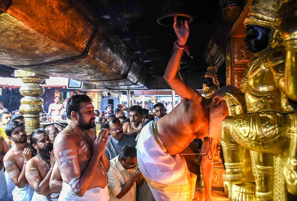 The temple opened on Friday amid a tense standoff involving social activist Trupti Desai in Kochi and a move by its administrator to seek time from the Supreme Court to implement its verdict. PTI Photo 