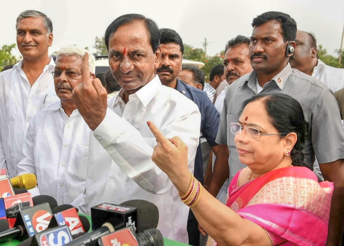 Telangana caretaker Chief Minister K Chandrasekhar Rao and his wife Shobha show their ink-marked finger after casting vote for the state Assembly elections, at a polling station in Hyderabad. PTI File Photo 