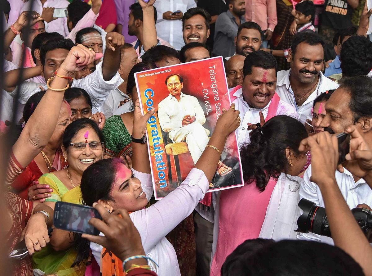 Telangana Rashtra Samithi (TRS) Party workers celebrate their party's victory in the states Assembly elections, at Telangana Bhavan in Hyderabad, Tuesday, Dec. 11, 2018. (PTI Photo)