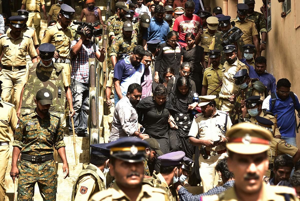 On Sunday, the Sabarimala foothills had witnessed high drama as hundreds of devotees blocked paths and chased away a group of 11 women of menstruating age being escorted to the hill shrine by police. (AFP Photo)