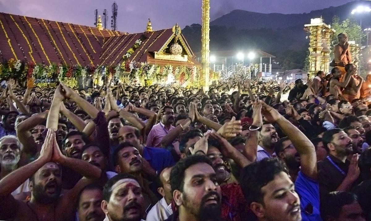 Devotees gather to offer prayers during Makaravilakku festival, at Sabarimala, Monday, Jan. 14, 2019. (PTI Photo)