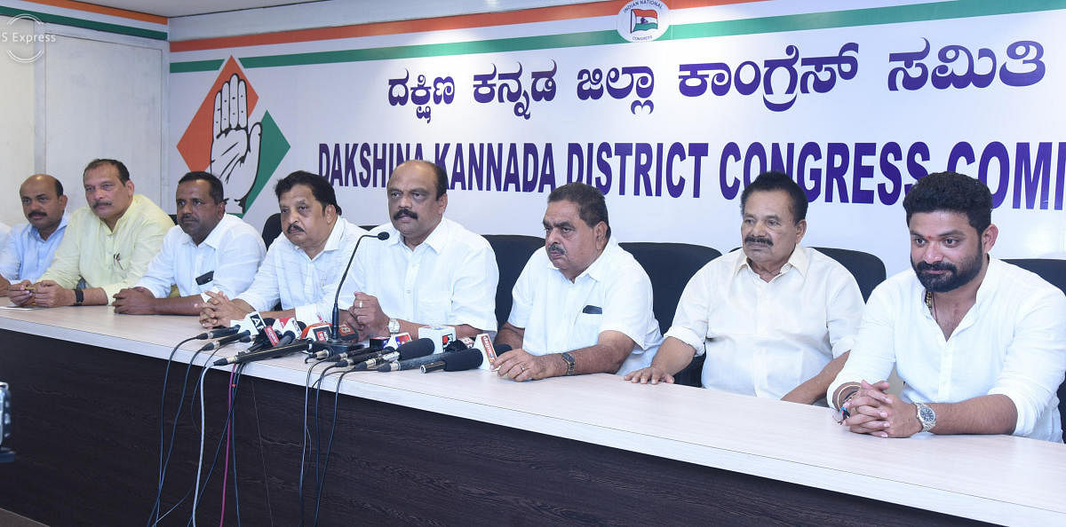 MLC and district Congress committee president Harish Kumar speaks during a press conference in Mangaluru on Sunday. Former ministers B Ramanath Rai and Amarnath Shetty, coalition candidate from Dakshina Kannada LS constituency, Mithun Rai, JD(S) district