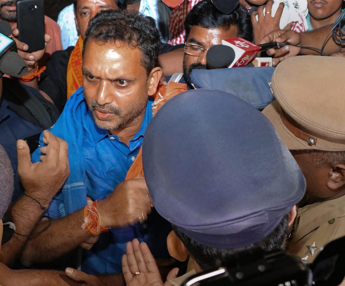 BJP's Kerala state general secretary K Surendran being taken into preventive detention near Sabarimala by the state police when he came to visit Sabarimala, Saturday. Nov 17, 2018. (PTI Photo)