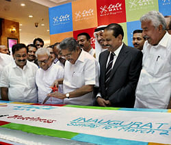 Union Minister Vayalar Ravi (C) with opposition leader VS Achuthanandan ( 3rd left), Kerala Chief Minister Oommen Chandy at the opening ceremony of the largest mall in India, in Kochi on Sunday. PTI Photo