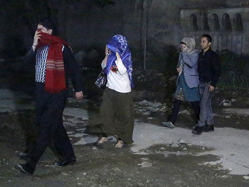 People walk after they were rescued from the site of an attack in Kabul. Reuters File photo.