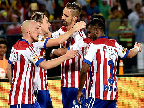 Atletico de Kolkata players celebrate after a goal against Kerala Blasters FC during an ISL match in Kolkata on Tuesday. PTI Photo