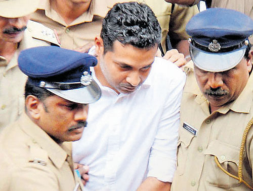 Kerala businessman Mohd. Nisham being taken to a court in Thrissur on Wednesday. PTI