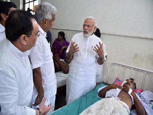 Hours after the tragedy, Modi had visited the temple premises and taken stock of the situation arising out of the mishap. Chandy and Chennithala had taken the Prime Minister around the temple precincts and briefed him on the incident. Later, Modi had visited the injured people in various hospitals in Kollam and Thiruvananthapuram. PTI file photo
