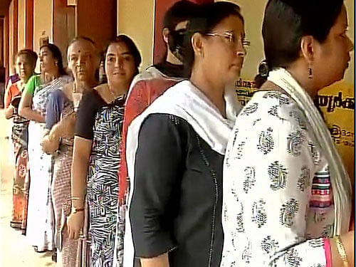 Voting begins in Kerala, visuals from a polling booth in Chathamangalam: People queue up to cast their vote. ANI