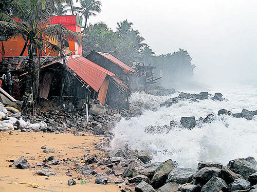 A rough sea causes damage to houses in coastal region of Thiruvananthapuram on Tuesday.