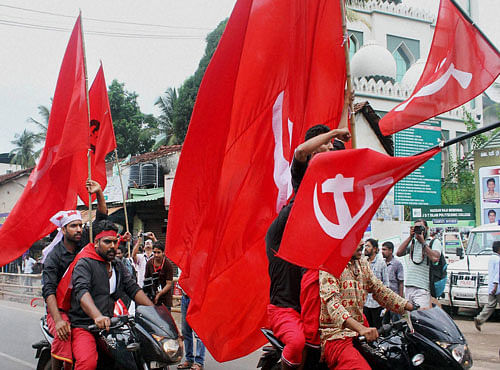 LDF workers take out a road show to celebrate their victory in the assembly elections in Kozhikode on Thursday. PTI Photo
