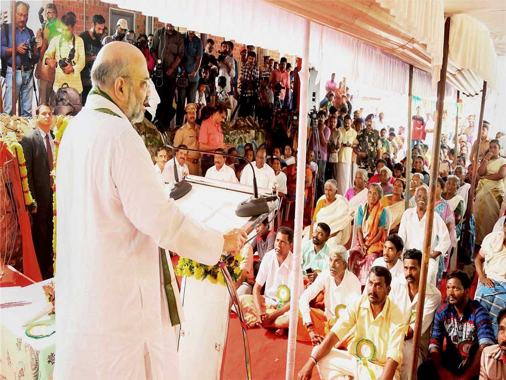 BJP National President Amit Shah addresses the Kerala State BJP booth committee meeting in Trivandrum on Sunday. PTI Photo
