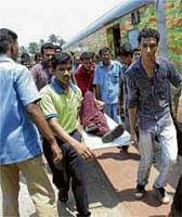 Sweet trip turns sour: Duronto Express passengers, who complained of food poisoning  after having a meal provided by the Railways during their journey, being taken to hospital in Kozhikode on Monday. Pti
