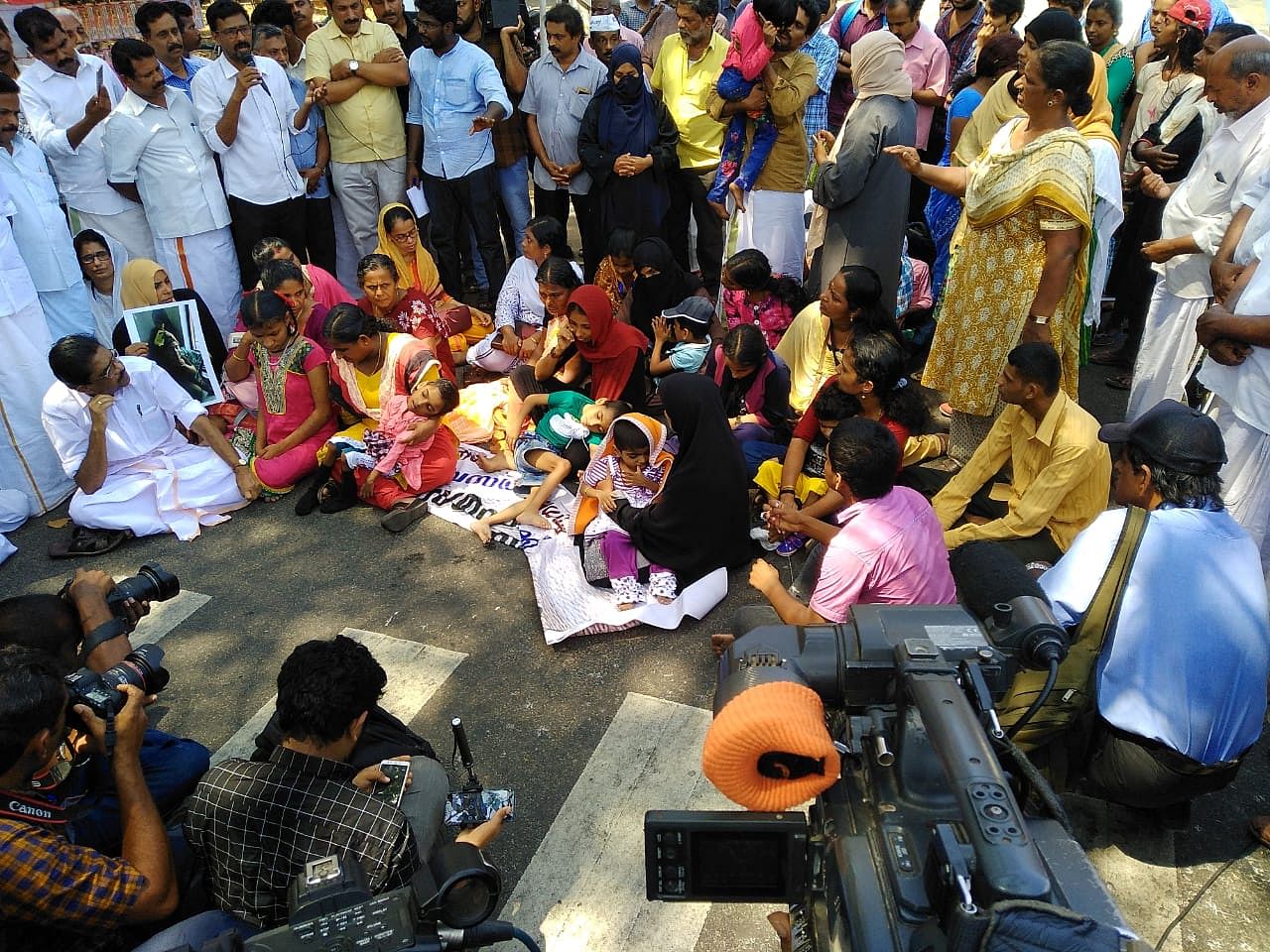 Endosulfan victims from North Kerala's Kasargod staging a sit-in near Kerala Chief Minister Pinarayi Vijayan's official residence as part of ongoing indefinite hunger stir in Thiruvananthapuram.