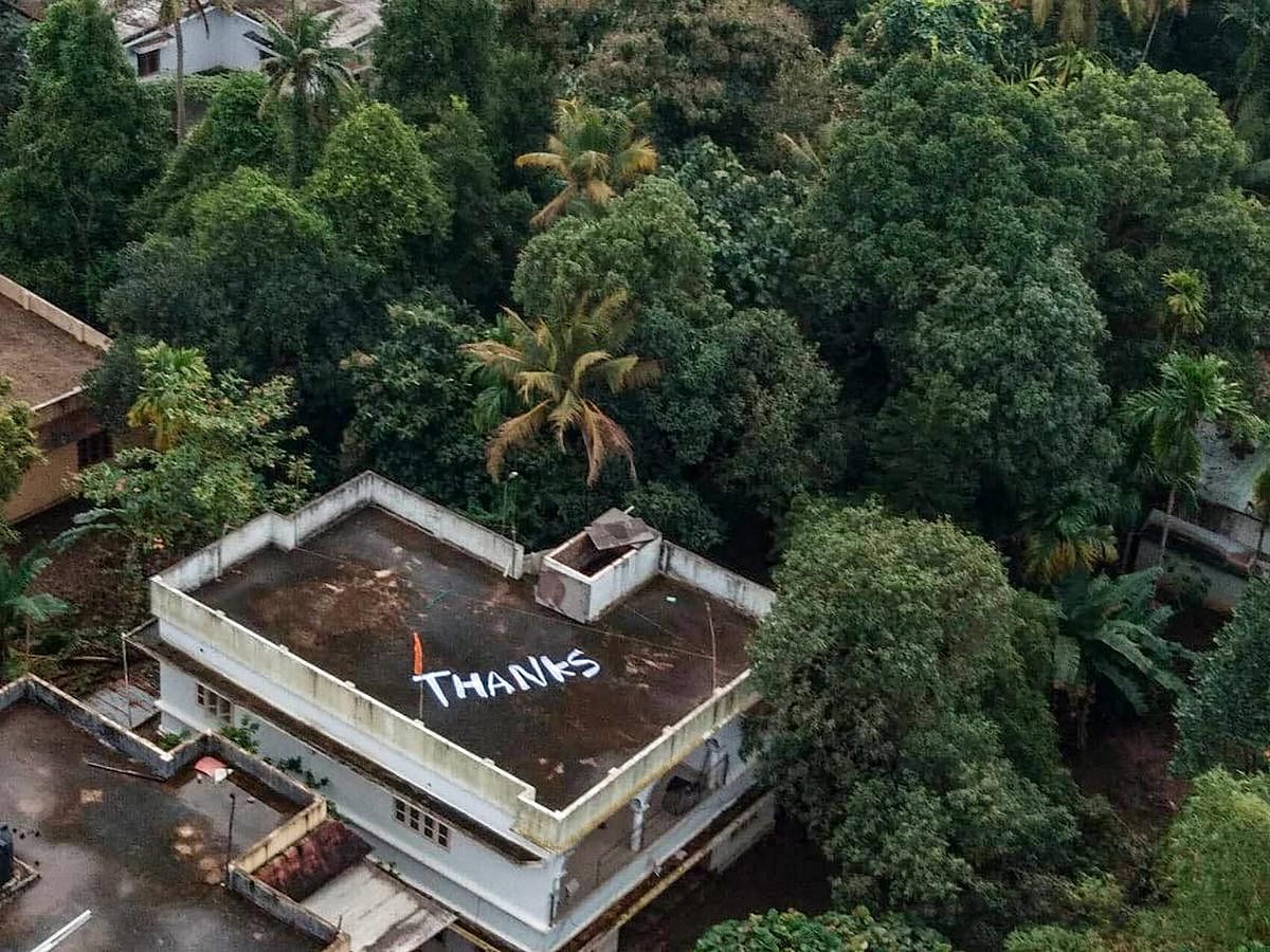 Kochi: 'Thanks' is written on the roof of a building to convey Kerala people's gratitude to Indian Navy and Air Force for their rescue and relief operations towards the flood-affected people, at North Paravoor in Kochi on Monday, Aug 20, 2018. (PTI Photo)