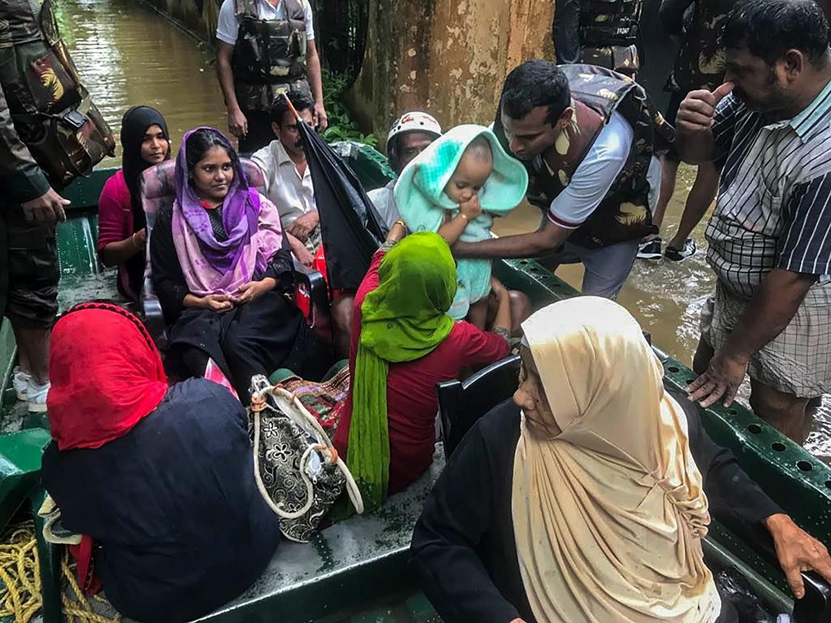Indian Army personnel rescue flood-affected people in Ernakulam district of Kerala on Tuesday. PTI Photo