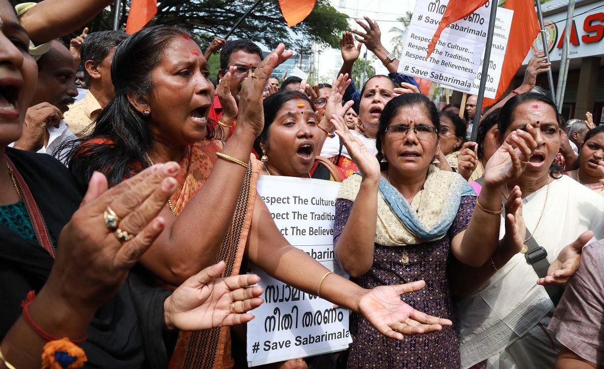 Indian Hindu activists protest following the arrest of devotees at Sabarimala temple in Kochi on Monday. PTI