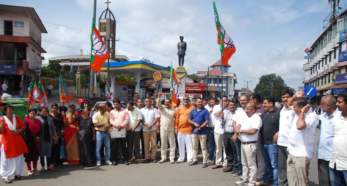 BJP and Vishwa Hindu Parishad leaders protest at General Thimayya Circle in Madikeri on Tuesday against the Kerala government.