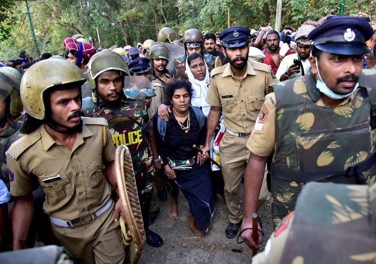 Bindu Ammini, 42, and Kanaka Durga, 44, are escorted by police after they attempted to enter the Sabarimala temple in Pathanamthitta district. Reuters File Photo 