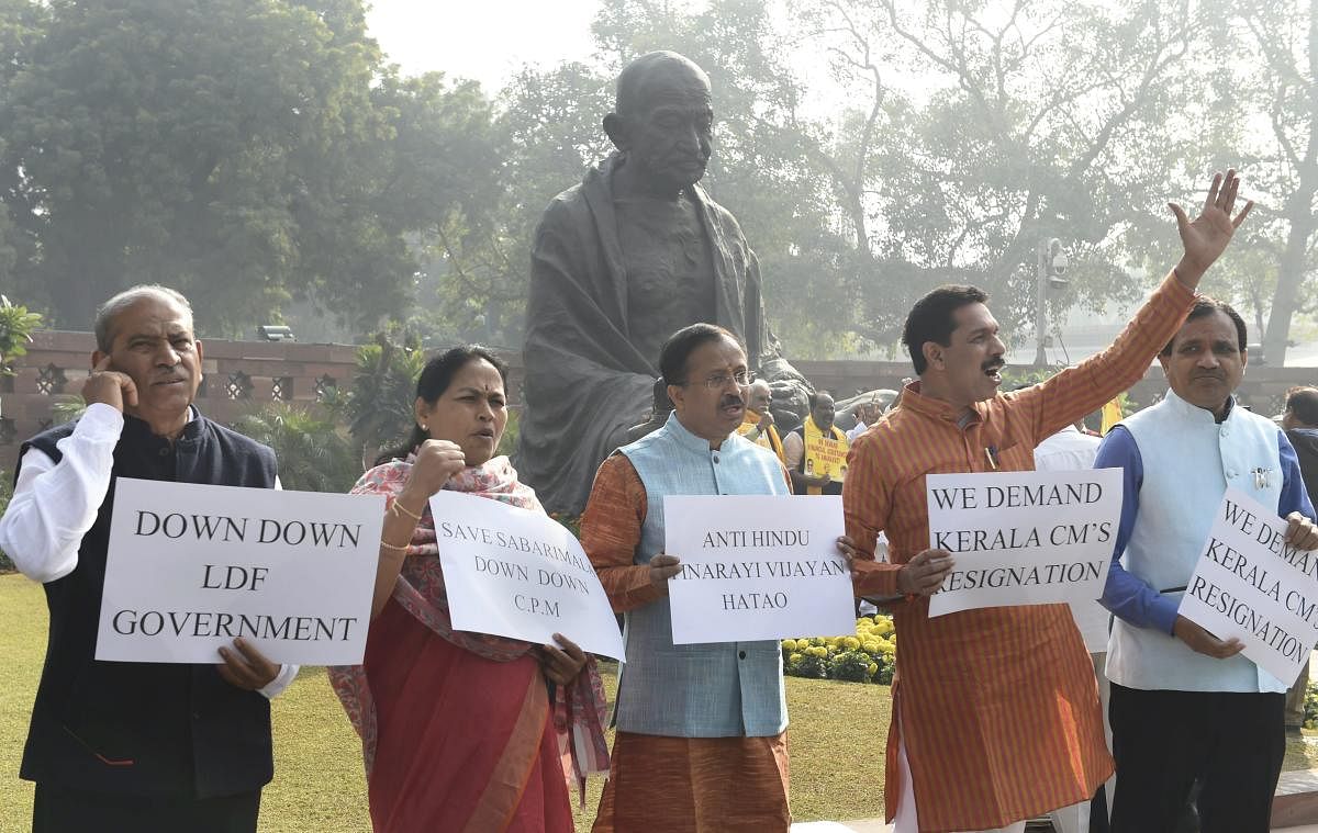 BJP MPs raise slogans against Kerala Chief Minister Pinarayi Vijayan regarding Sabarimala issue during the ongoing Winter Session of Parliament in New Delhi on Jan 4, 2019. PTI
