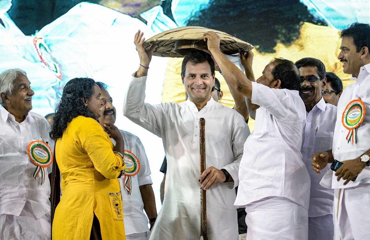 Congress President Rahul Gandhi being felicitated during an event to address 'fishermen's parliament', at Triprayar in Thrissur, Thursday, March 14, 2019. PTI