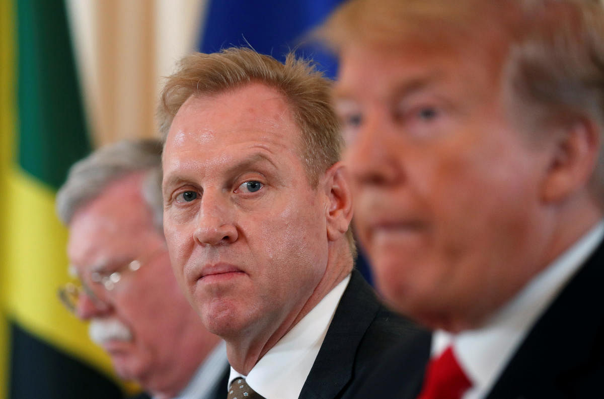 Acting Defense Secretary Patrick Shanahan, seated between National Security adviser John Bolton and U.S. President Donald Trump, listens during meeting with the leaders of The Bahamas, the Dominican Republic, Haiti, Jamaica and Saint Lucia at Mar-a-Lago i