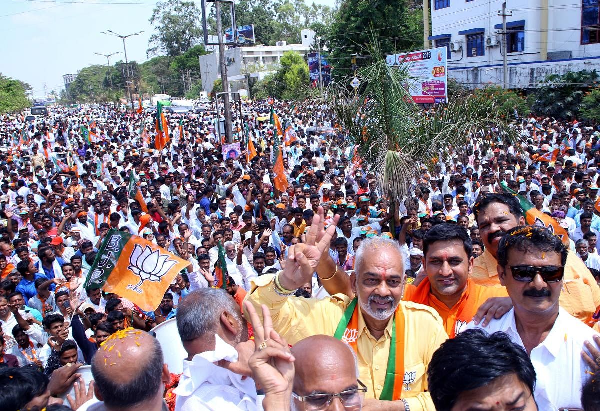 BJP candidate A Manju takes out a road show in Hassan before submitting his nomination papers for Lok Sabha elections on Monday. DH Photo