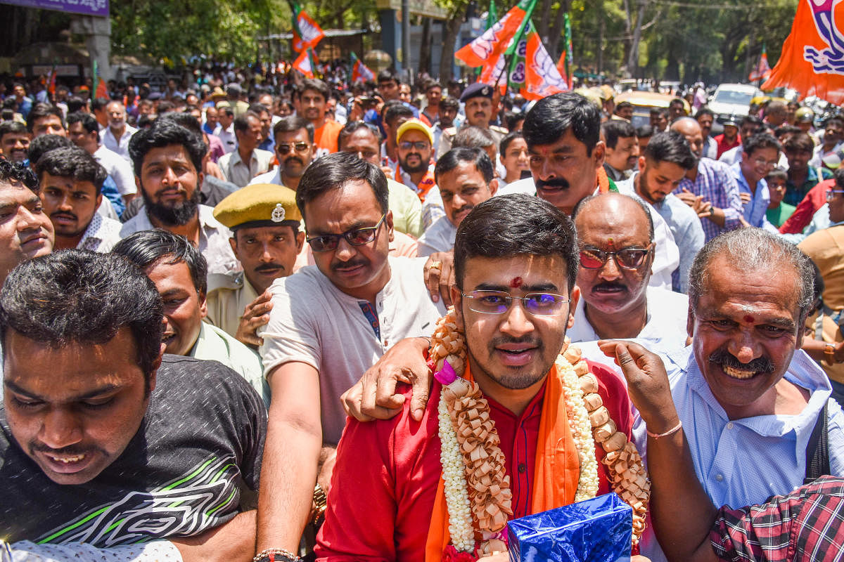 Bangalore South BJP candidate Tejasvi Surya L S takes out a rally near Dodda Ganapathi Temple in Basavanagudi before filing his nomination in Bengaluru. DH photo/S K Dinesh