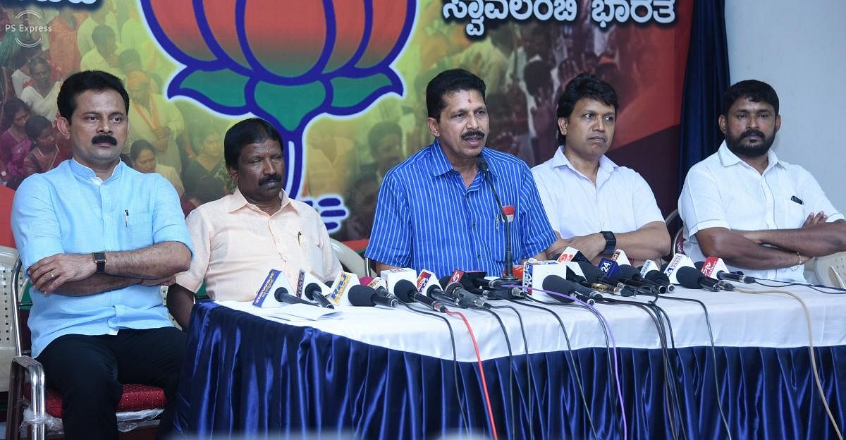 BJP district unit president and Puttur MLA Sanjeev Matandoor (centre) speaks to reporters on Tuesday.