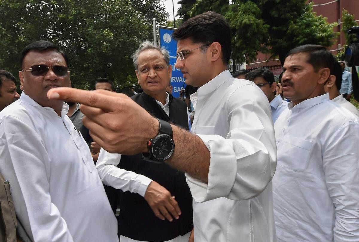Congress leaders Ashok Gehlot and Sachin Pilot leave after a meeting with the Election Commissioner at Nirvachan Sadan, in New Delhi on Tuesday. PTI