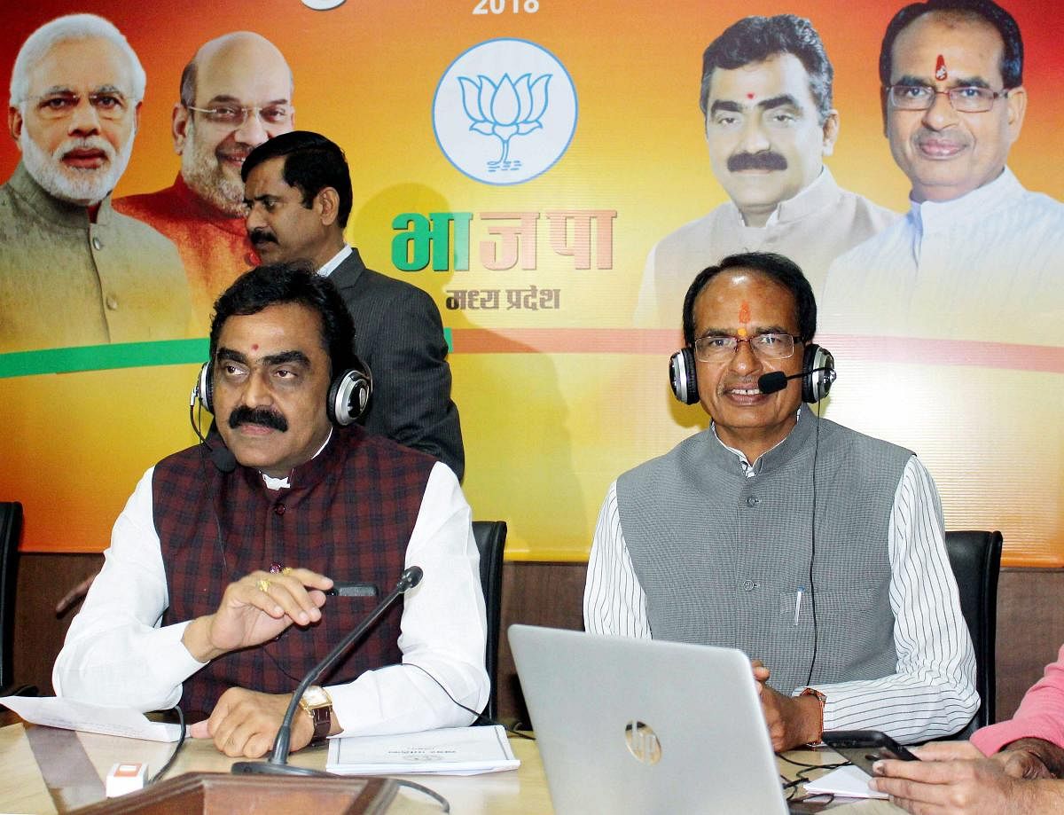 Madhya Pradesh Chief Minister Shivraj Singh Chouhan and BJP State President Rakesh Singh. PTI Photo