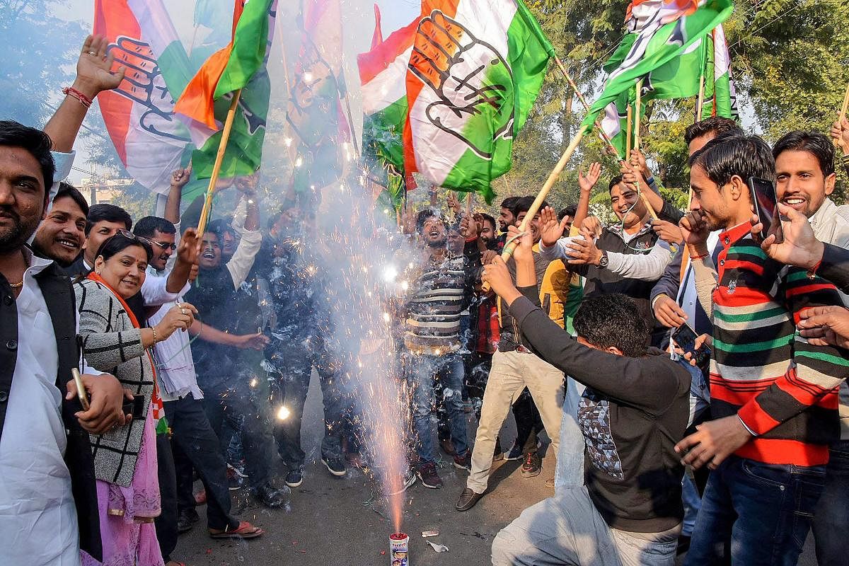 Congress workers and supporters burst fire crackers to celebrate the counting trends that show the party's win in the Rajasthan Assembly elections, in Jaipur, Tuesday, Dec 11, 2018. (PTI Photo)