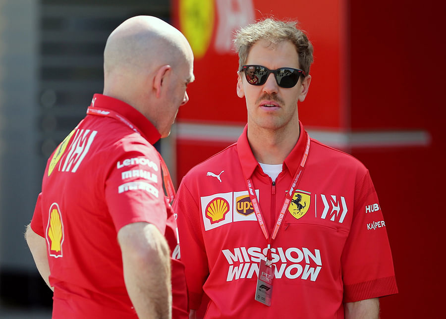 Ferrari's Sebastian Vettel in conversation with team personnel ahead of the Bahrain Grand Prix this Sunday. Picture credit: Reuters