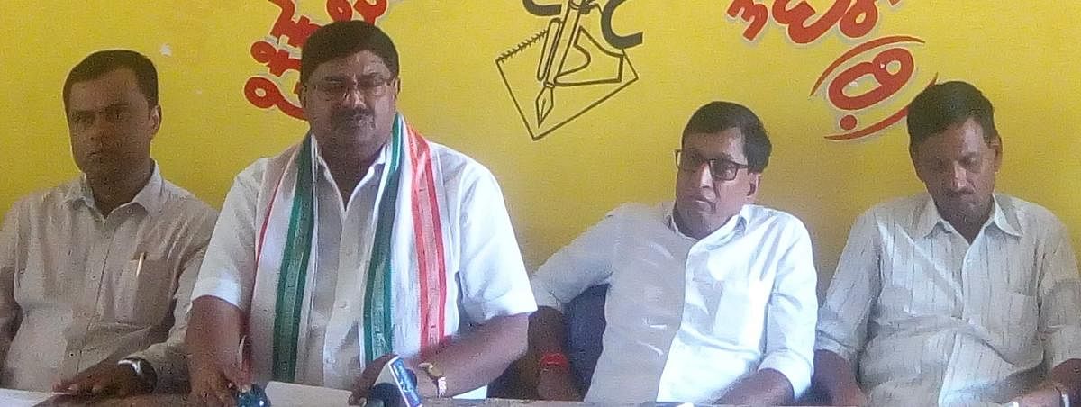 Congress-JD(S)-CPI District Coalition Committee president Dr D L Vijaykumar speaks during a press conference in Chikkamagaluru on Thursday. MLC S L Bojegowda, JD(S) district president Ranjan Ajith Kumar and CPI district convener H M Renukaradhya look on.