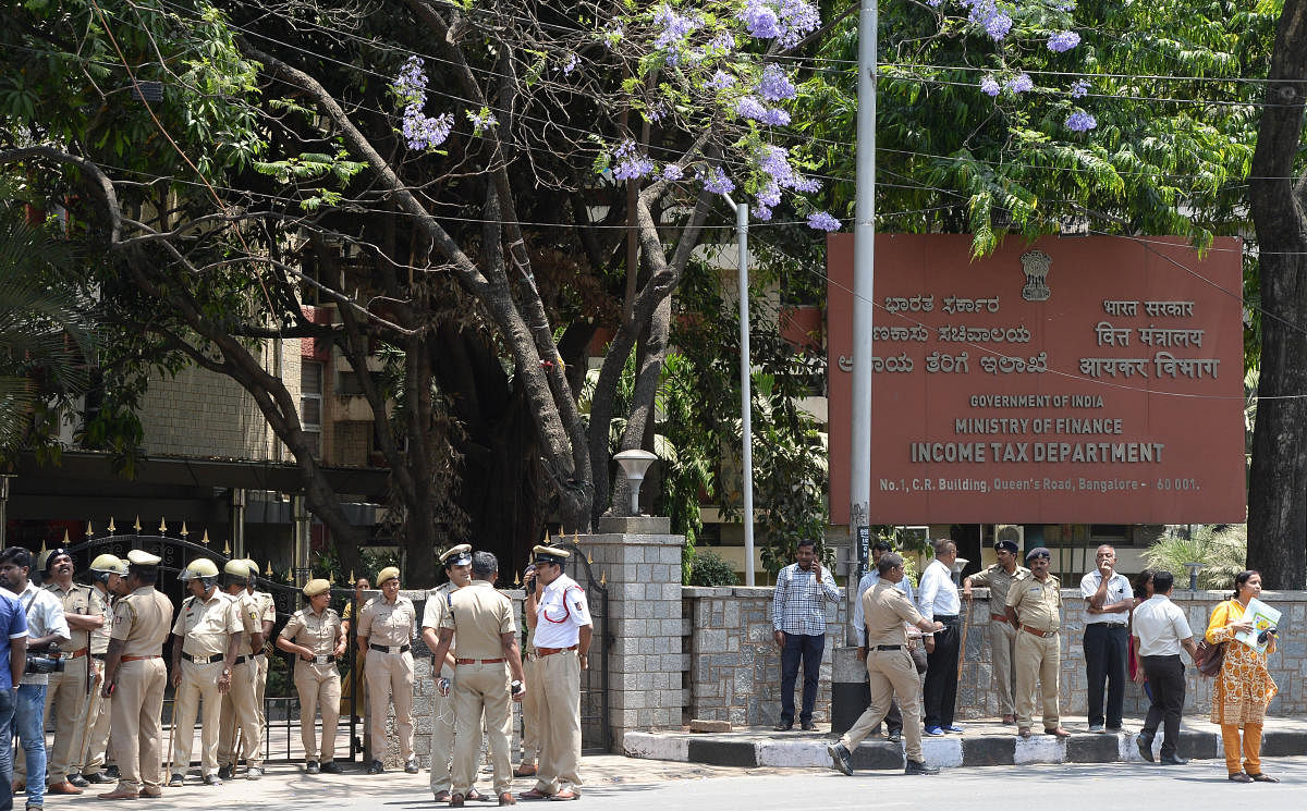 Security was beefed up at the office of the Department of Income Tax in Bengaluru, following protests by the Congress and the JD(S) leaders against I-T raids on JD(S) leaders, on Thursday. DH Photo