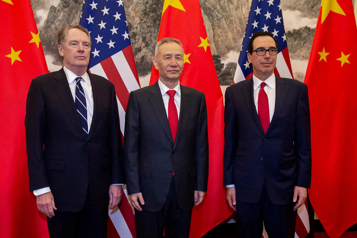 China's Vice Premier Liu He (C) pose for a photo with U.S. Treasury Secretary Steven Mnuchin (R) and U.S. Trade Representative Robert Lighthizer (L) at Diaoyutai State Guesthouse in Beijing on March 29, 2019. Nicolas Asfouri/Pool via REUTERS