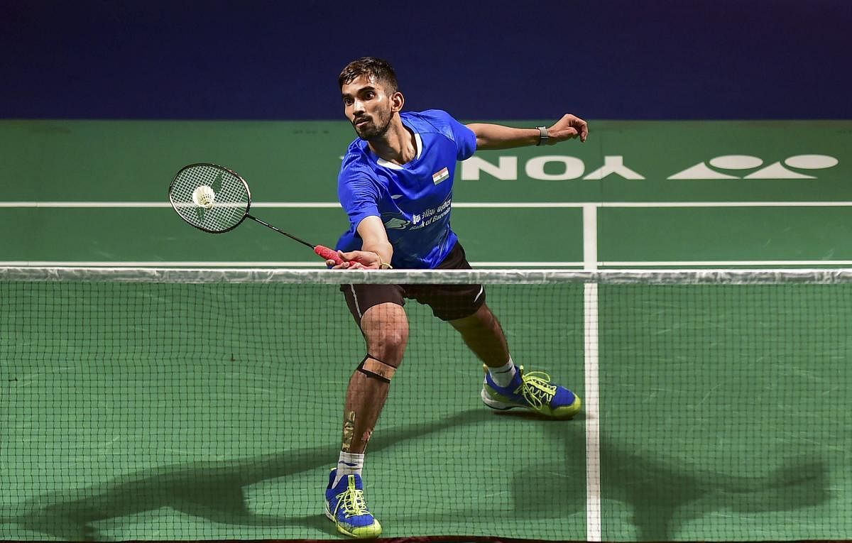 ON SONG: India’s Srikanth Kidambi returns a shot to Huang Yuxiang of China during their semifinal match in New Delhi on Saturday. PTI