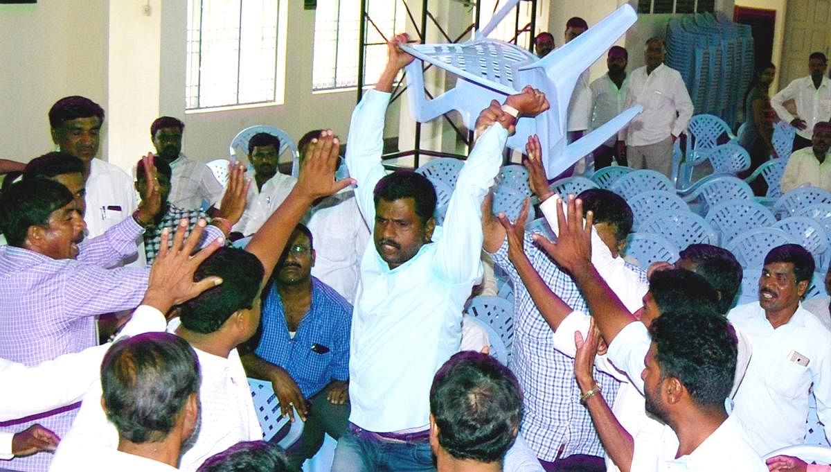 Congress workers create ruckus during the party's election meeting held in Belur, Hassan district, on Saturday. DH PHOTO