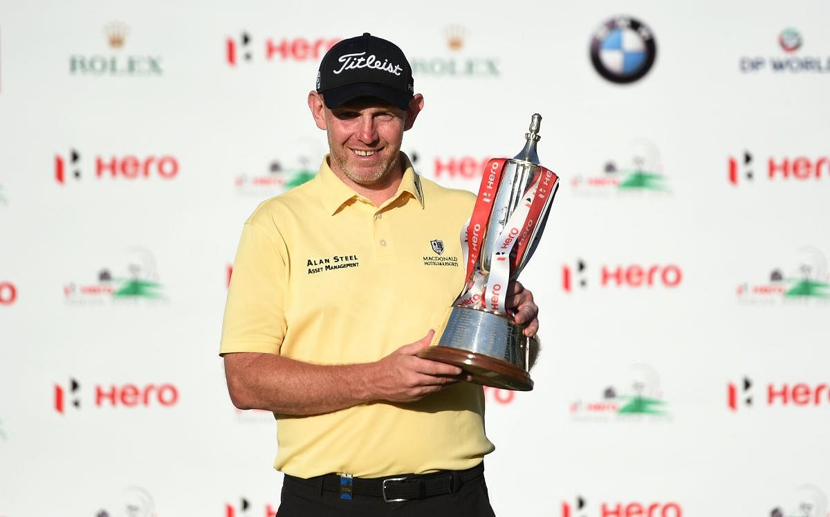 BIG WIN Stephen Gallacher of Scotland with the Indian Open trophy on Sunday. AFP