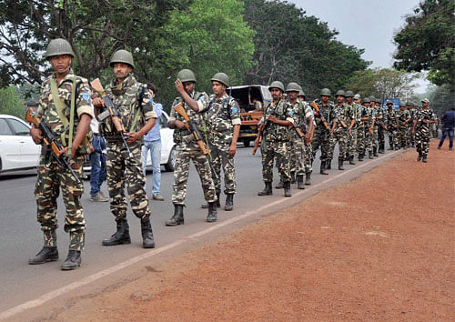 Paramilitary jawans conduct a flag march on the eve of 5th phase of Lok Sabha elections in Ranchi on Wednesday. PTI Photo