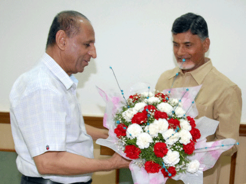 TDP President N Chandra Babu Naidu meets Governor of AP ESL Narasihman at Raj Bhavan in Hyderabad. PTI photo