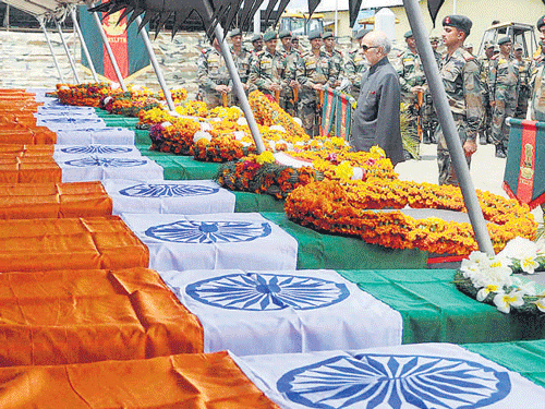 Manipur governor Dr Syed Ahmad pays tribute to the soldiers in Imphal on Saturday. PTI