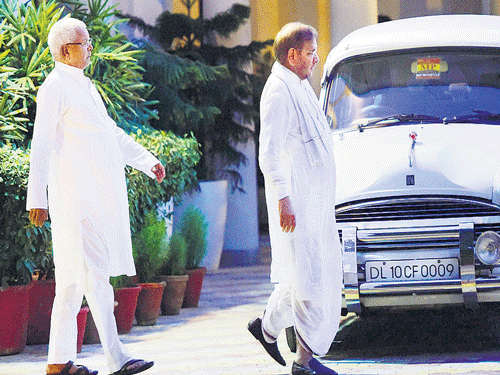 RJD chief Lalu Prasad Yadav and JD-U President Sharad Yadav leave fromthe residence of Samajwadi Party chief Mulayam Singh Yadav in New Delhi on Sunday. PTI