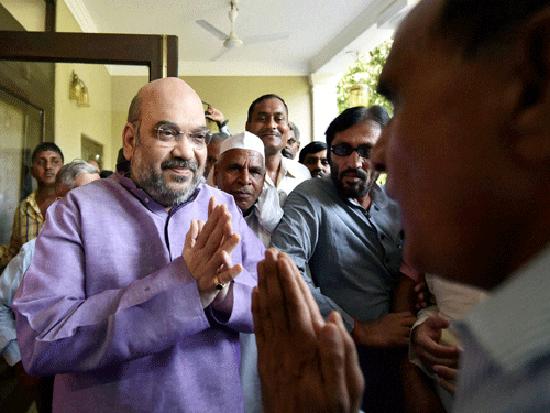 BJP President Amit Shah greets Ex-servicemen after the government announced the implementation of the long-awaited One Rank One Pension (OROP), in New Delhi on Saturday. PTI Photo